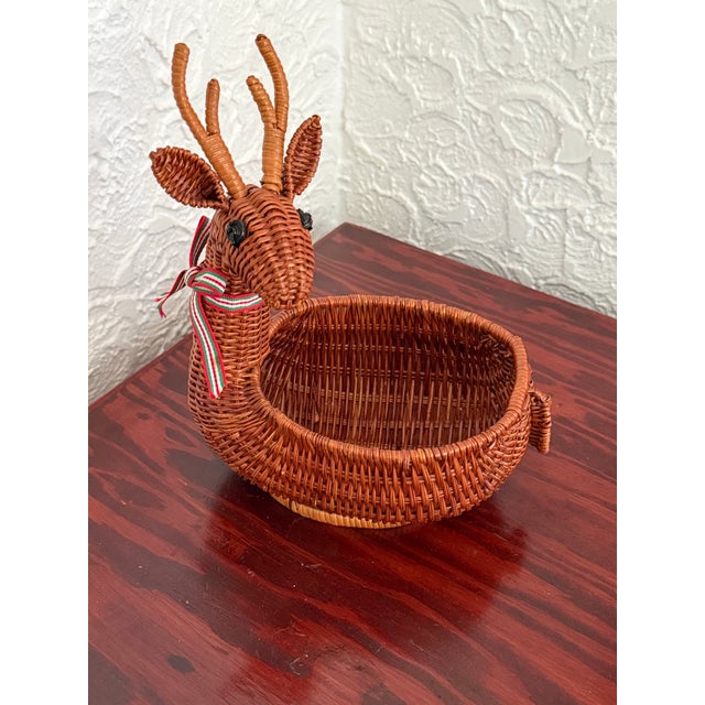 A sweet vintage woven wicker reindeer basket with antlers, perky ears, and a festive ribbon. Fill with ornaments or...