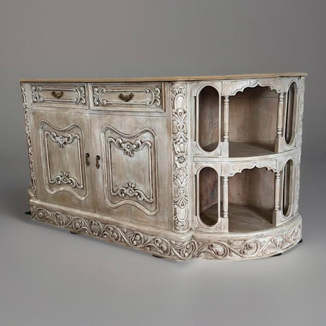 This stunning French buffet is a beautifully hand-carved piece that exudes elegance and charm. Featuring intricate floral...