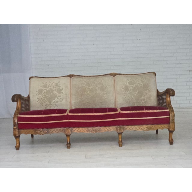 1930s, Danish 3-seater sofa. Original red furniture velour, handcarved ash wood, furniture mesh, brass springs in the...