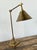 This striking vintage desk lamp is a masterful blend of industrial utility and sophisticated mid-century design. Crafted...