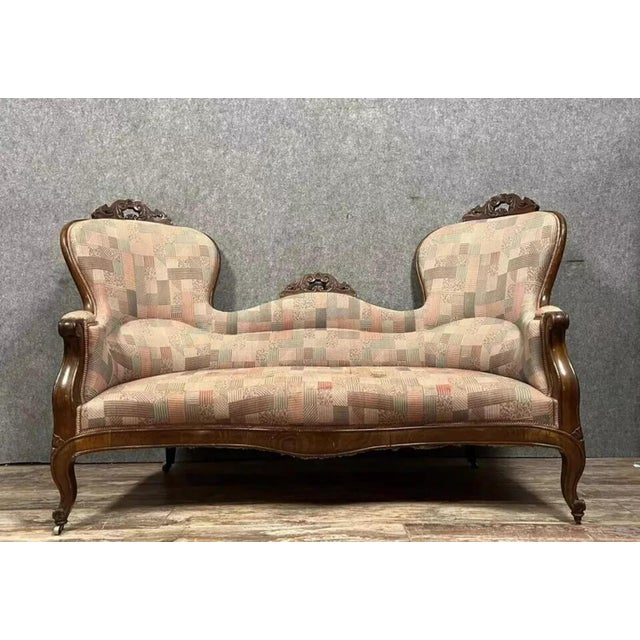 Napoleon iii period mahogany wing bench the upper section, carved and molded with scrolling foliage, features hand notches...