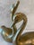 A pair of vintage mid century modern solid brass (heavy) "love" swans. Swans have a nice patina. Small swan measures - 5"w...