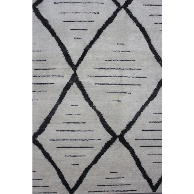 A beautiful handmade Bamboo silk rug. The geometric design woven in by Aara Rug hands. This rug is made of 75% bamboo silk...