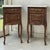 A fine pair of French Louis XV style antique nightstands crafted in oak and topped with beautifully shaped Carrara marble....