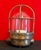 Vintage industrial lamp with an authentic character, crafted with a brass-colored metal body, a thick, bell-shaped glass...