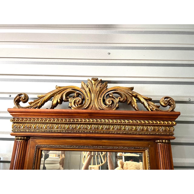 Large wood hand carved mirror. Hang on the wall or lean it on the floor. Beautiful carving and gold accents.