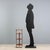 Walnut valet stand with brass trim and inlays. Three octagonal, revolving tray shelves supported by lateral legs with...