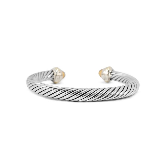 Brand: David Yurman Gender: Ladies Metal Type: 14K Yellow Gold and Silver Length: 6.50 inches Width: 7.00 mm Weight: 43.44...