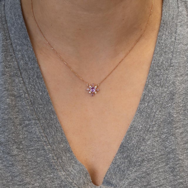 Blush brilliance meets timeless luxury — a pink sapphire pendant glowing in solid 14K gold with sparkling natural diamond...