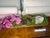 Botanical mixed potted arrangement in like-new condition, featuring elegant purple orchids paired with striking geode...