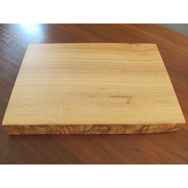 Scarce, maple cutting board or plinth display platform designed by MIRA NAKASHIMA for the GEORGE NAKASHIMA STUDIO. The...
