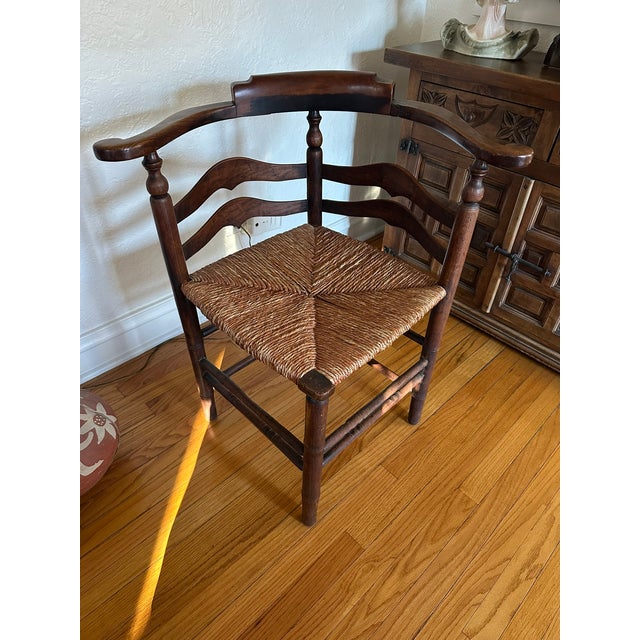 Early American Delaware Corner Chair with Woven Seat A sculptural gem of colonial design, this Delaware corner chair...