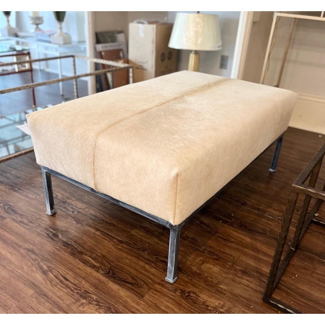 Beautiful champagne color cowhide upholstered on this deep bench- Legs hand painted in charcoal wash finish - Set a tray...
