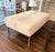 Beautiful champagne color cowhide upholstered on this deep bench- Legs hand painted in charcoal wash finish - Set a tray...