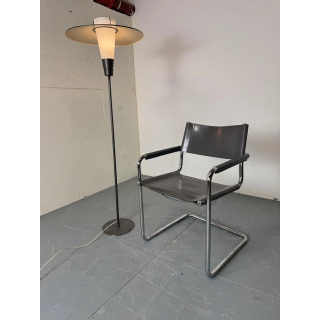 Mid Century Modernist grey steel, brass and glass floor lamp, 1950s The frame and shade are grey. The base has nice brass...