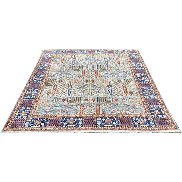 Modern Handwoven Bijar Style Area Rug featuring an allover design in a burgundy pattern on a light blue colored...