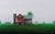 Spring Morning by Michael Miller | Oil on Panel of a red barn in a green field with trees For Sale