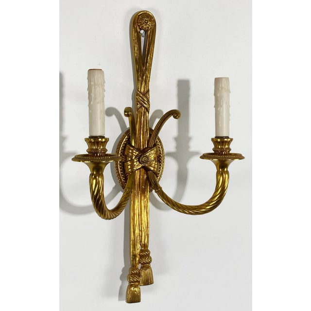 Vintage heavy gilt toned rope with tassel motif wall sconces. A classic design that accommodates a variety of design...