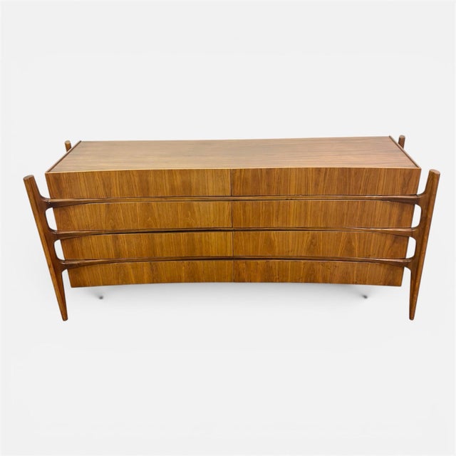 Amazing and rare! This 8 drawer dresser or credenza by William Hinn is a collectible grade piece that will only increase...