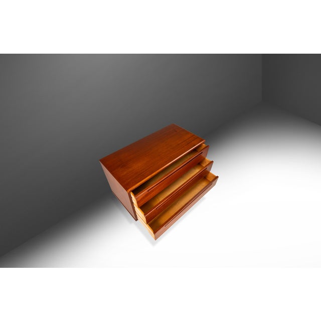Introducing a true Danish Modern marvel: a rare three drawer dresser designed by the influential Nils Jonsson for Torring...
