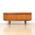 This rather rare mid-century credenza was produced by Elliots of Newbury during the 1960s. A distinctive gently curved...