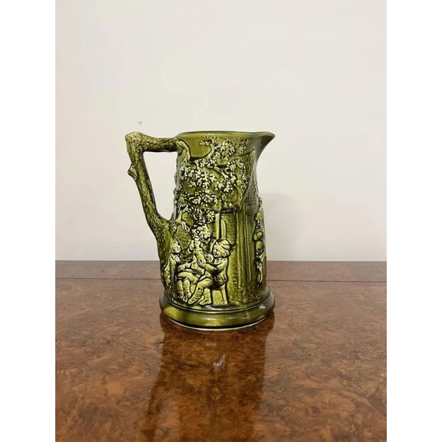 Unusual antique Edwardian quality majolica jug having wonderful detailed decretive figural scenes a shaped handle to the...