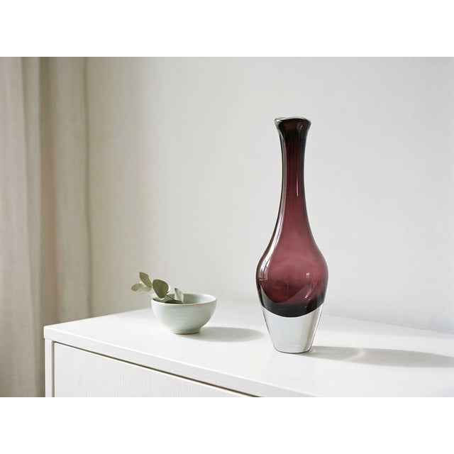 Nils Landberg (1907–1991) was a prominent Swedish glass designer, particularly known for his elegant, clean lines and...