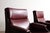 A refined pair of lounge chairs by sormani, italy, 1965. this striking design is defined by a sculptural wooden frame,...