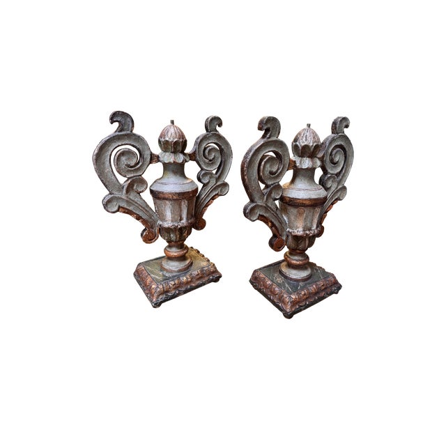 Beautiful 19th century Italian carved wood urns, featuring ornate scroll handles and a gilded finish. Beautiful rich...