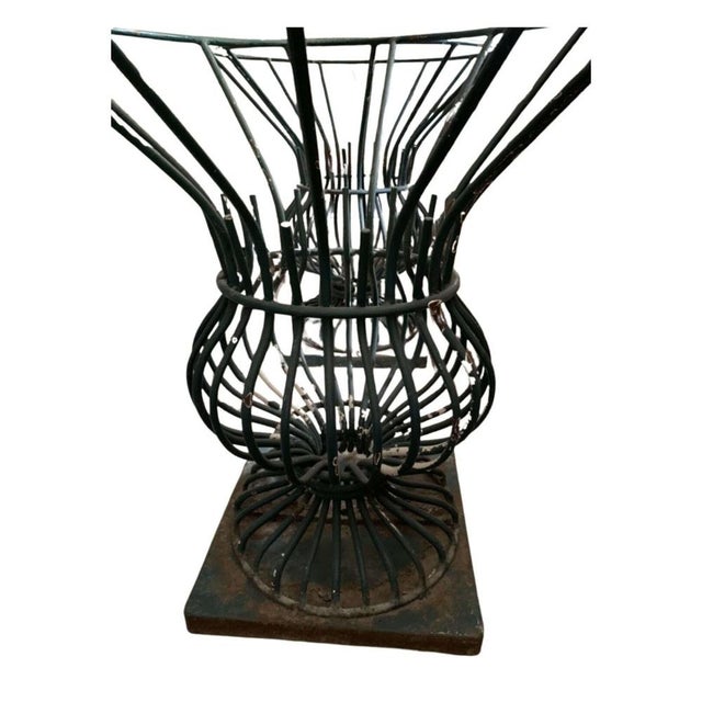 A pair of painted iron provincial town tree guards that are painted in a darkish green. Solid pieces that would easily...