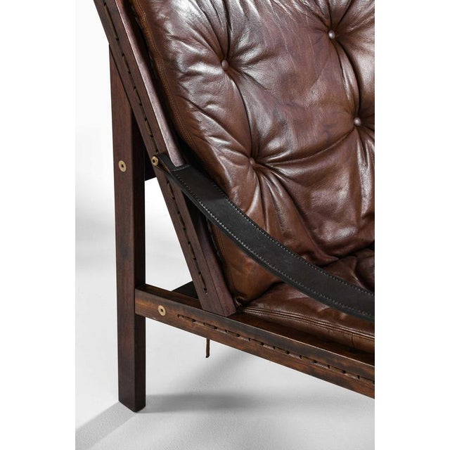 This rare pair of hunter easy chairs, designed by torbjørn afdal in 1962 and produced by bruksbo in norway, represents a...