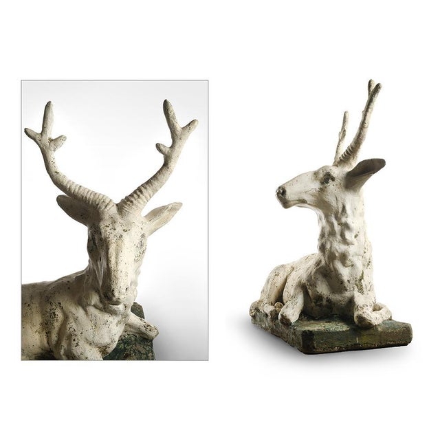 Deer sculpture cement. The deer is elongated and based on a stone base. This piece is designed in the style of the...