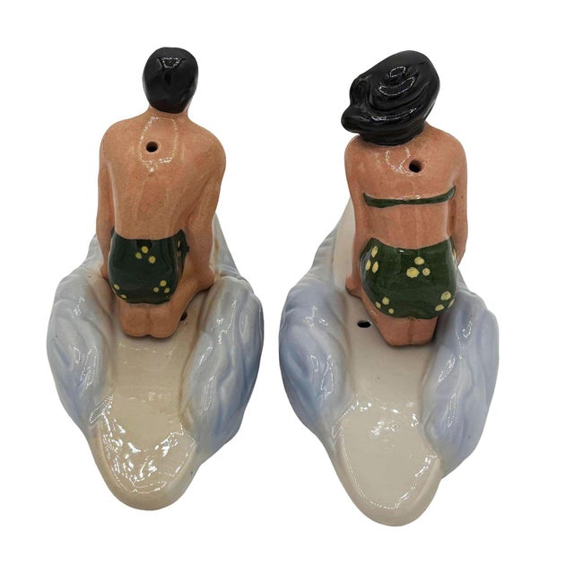 Rare 1951 ceramic Hawaiian male & female surfer salt & pepper shaker set made by Herman's. The set features a figurative...