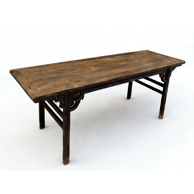 Constructed with traditional mortise and tenon joinery, this early-18th century painting table features a wide, flush-...