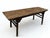 Constructed with traditional mortise and tenon joinery, this early-18th century painting table features a wide, flush-...