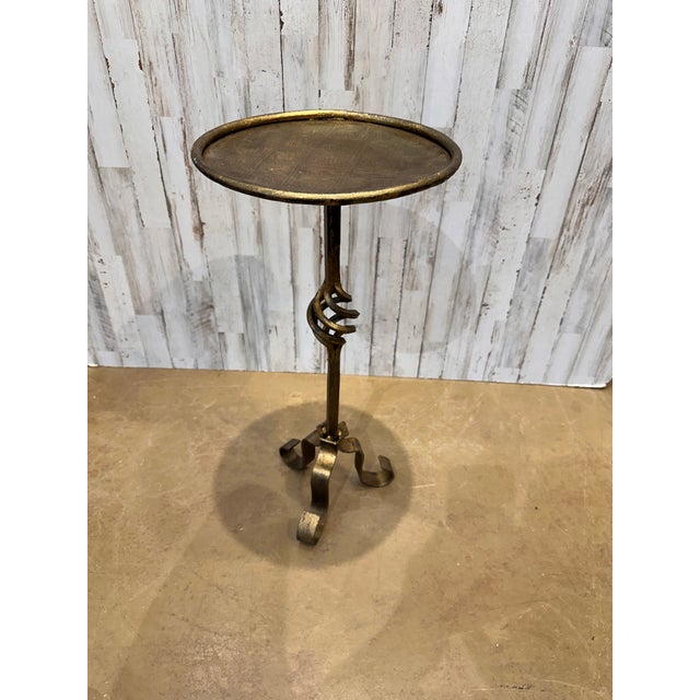This is wonderful little Spanish made wrought iron drink table with an antiqued gold finish. Contemporary yet antique...