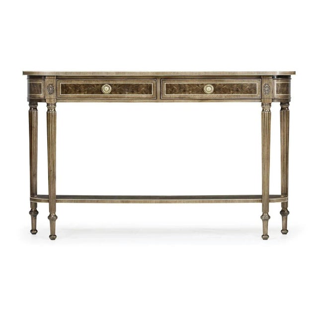 Bleached mahogany D form console table with an antiqued finish, two drawers above a shaped under tier set between elegant...
