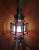 Medium size Moroccan frosty glass lantern, on a copper stained frame, measuring approximately 23" in height and 7.5" in...