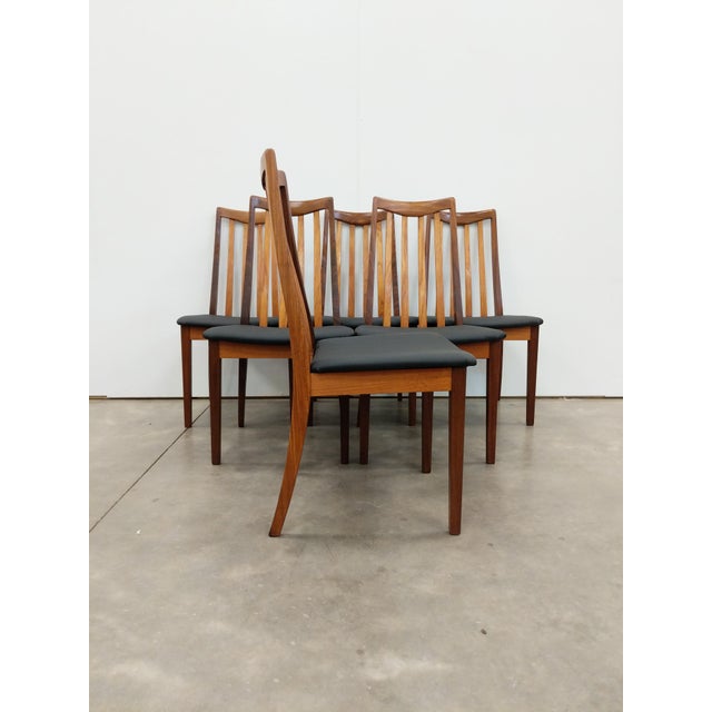 Set of 6 authentic vintage mid century modern dining chairs. In teak and afrormosia (aka African teak) woods. Designed by...