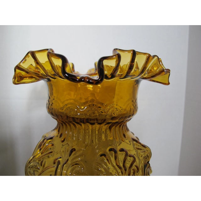 Stunning amber glass vase that will change the look of any room. I love the embossed shell-like design and the ruffled...