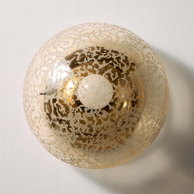Guro wall lamp with organic patterns from the 1970s. Thanks to its glass lampshade, it gives off a cosy glow, making it a...