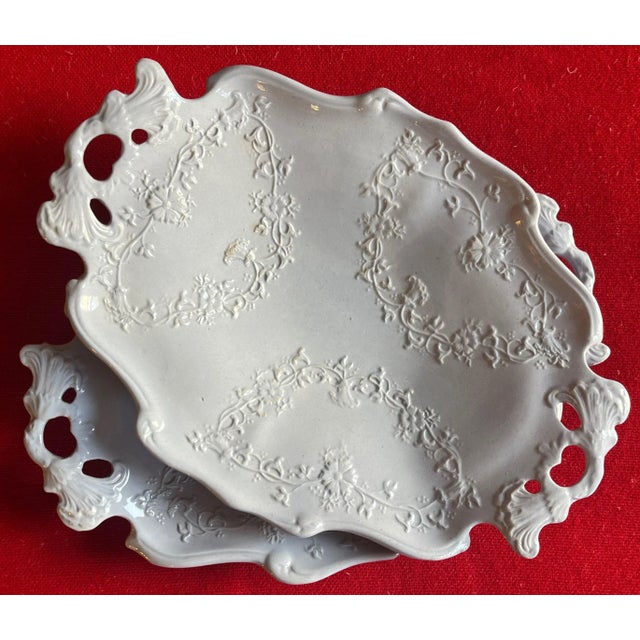 Pair antique 19th century English solid light blue Staffordshire pottery handled trays with relief decoration. Each...