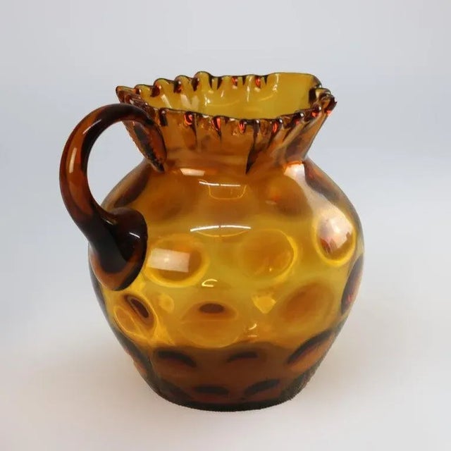 Amber Coinspot Amber Glass Juice Pitcher with Ruffled Rim 20thC Measures- 7.5"H x 6.5"W x 8"D