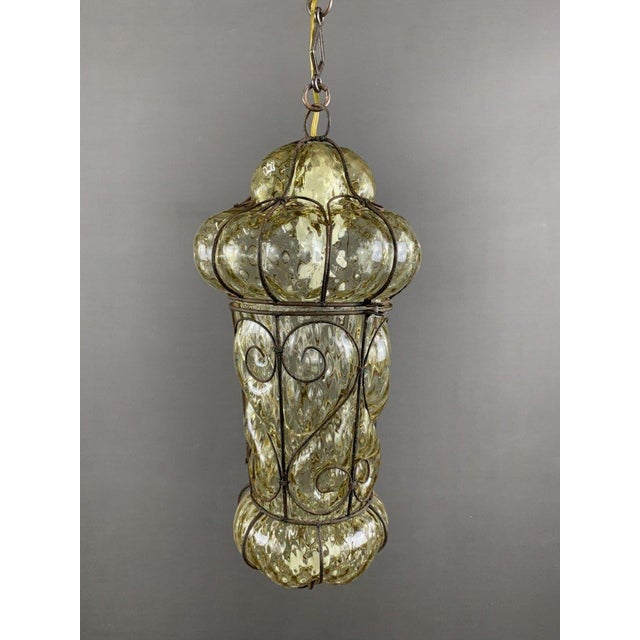 19th Century Metal and Murano Glass Pendant Light This majestic pendant light, with its bronze frame and Murano glass...