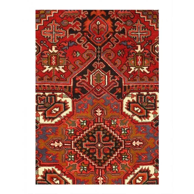 The brilliant Red field bears a central Ray of Life and many highly abstracted floral shapes in this fascinating antique...