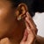 These elegant Art Deco inspired stud earrings showcase a refined target design centered around two round brilliant cut...