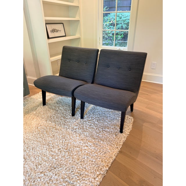Pair of Room & Board Delia Armless Chairs A stylish sloped chair with a curved seat offers great lines and incredible...