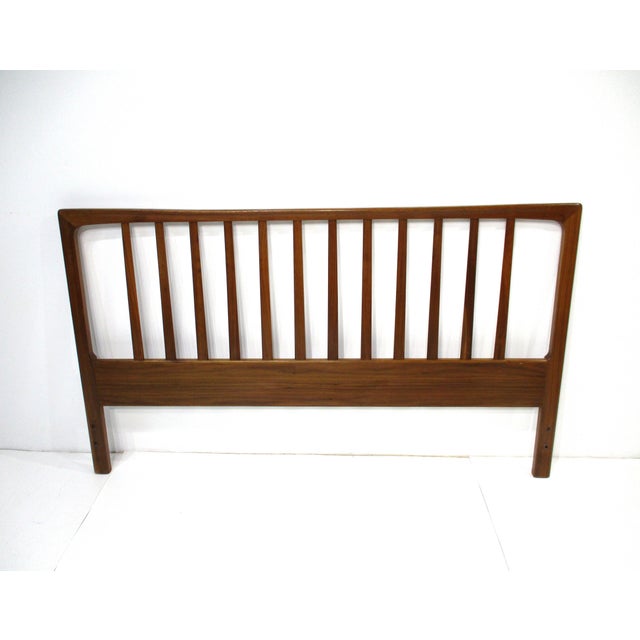 A solid teak wood spindle styled queen sized headboard with nice curved and rounded cornered top. The flat and rounded...