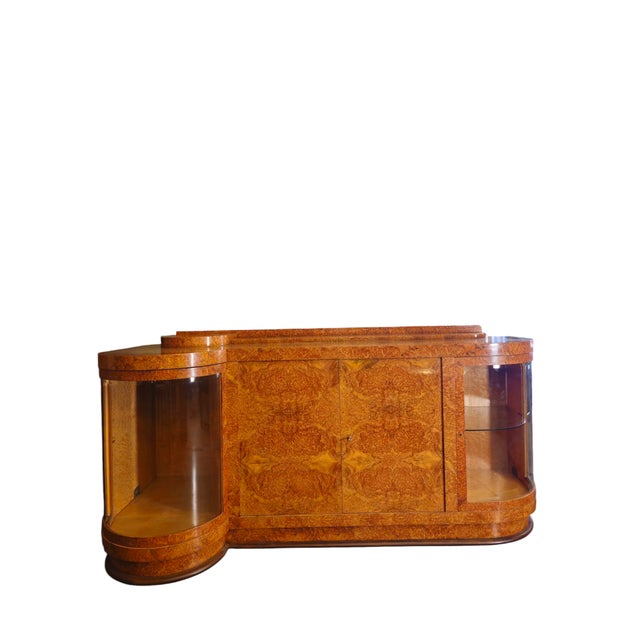 Belgian Art Deco Sideboard (1925-1930) – amboyna burl veneer - original curved glass Here is a detailed : The piece of...