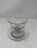 French pedestal glass candy dish with accompanying plate. This delicate piece with a striking vertical cut glass pattern...